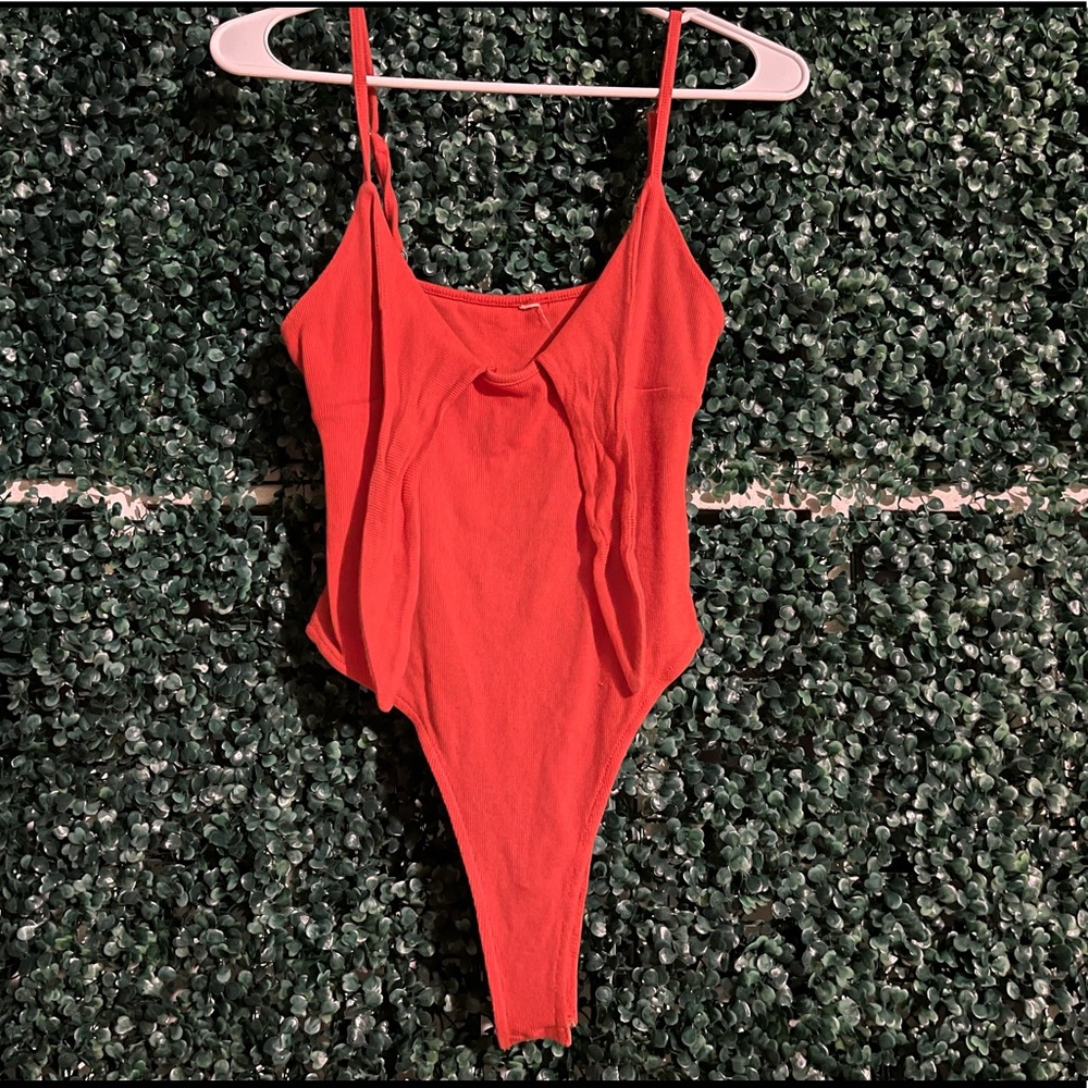 Orange body suit